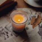 A cozy candlelit scene with vintage papers creating a warm, nostalgic atmosphere.